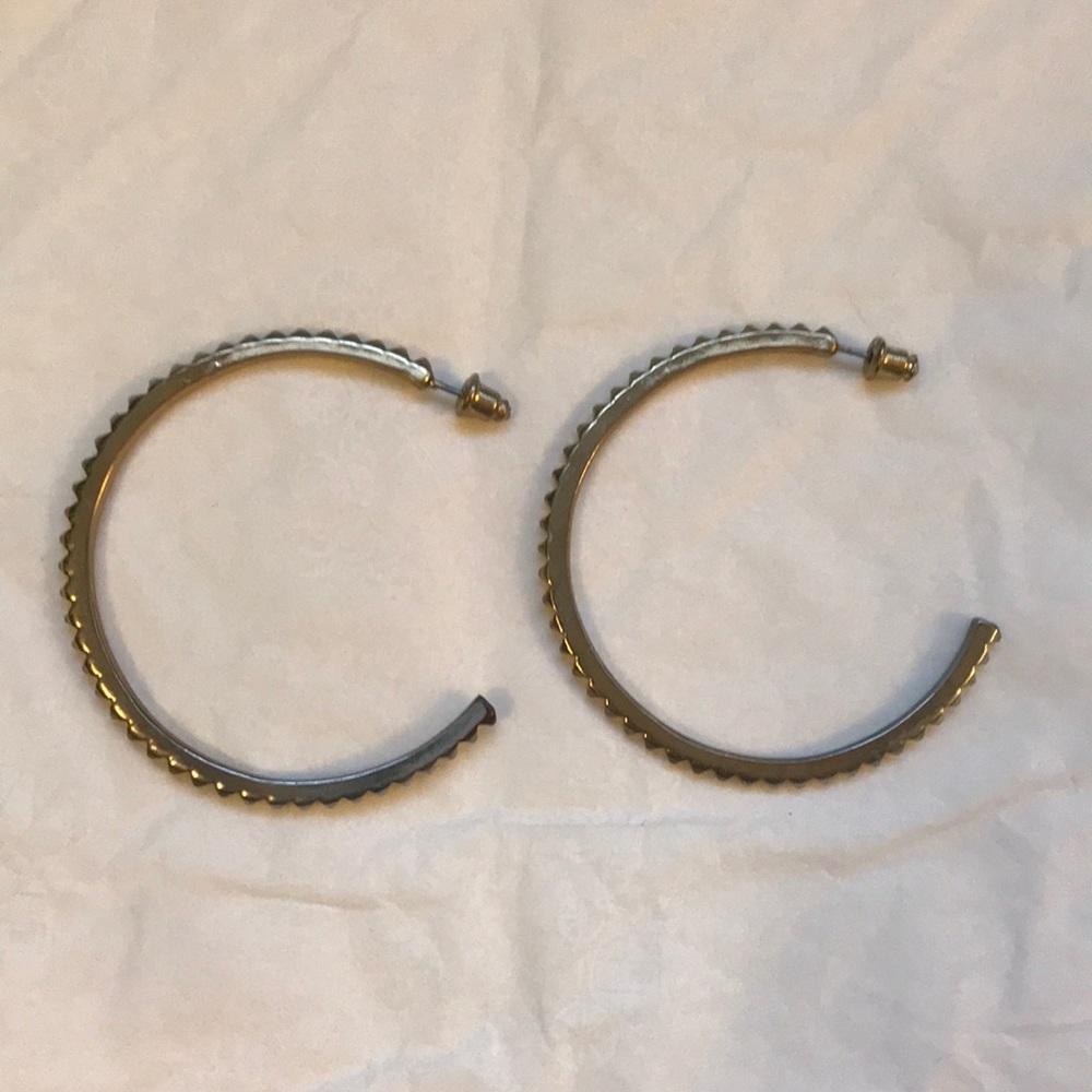 Gold tone spike hoop earrings